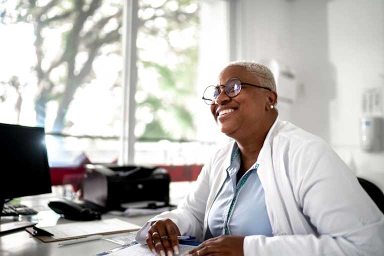 Psychologist smiling to patient on medical appointment